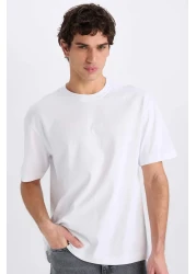 Defacto تي شيرت أبيض كبير الحجم برقبة دائرية وأكمام قصيرة E6885axns