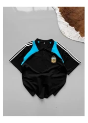 ozcelf تي شيرت أرجنتيني بياقة بولو كبير الحجم مطرز للجنسين