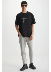 GRIMELANGE تي شيرت RAMADANP017 للرجال مصنوع من القطن بنسبة 100% برقبة دائرية ومطبوع باللون الأسود