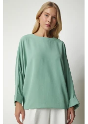 Happiness İstanbul بلوزة أيروبين فضفاضة بأكمام الخفاش باللون الأخضر المائي للسيدات TO00084