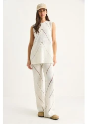 Bianco Lucci بلوزة نسائية بحزام سميك مع بنطلون فضفاض طقم تريكو صيفي رقيق من الأسفل إلى الأعلى 20251013