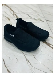 E Kandiş حذاء رياضي مريح لتقويم العظام باللون الأسود