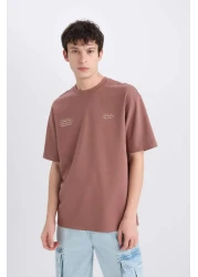 Defacto تي شيرت Boxy Fit برقبة دائرية لا يحتاج إلى كي وقابل للتنفس وأكمام قصيرة مطبوعة من القماش الثقيل E0574ax