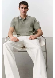 H&M قميص بولو جيرسي منسوج بقصّة Slim Fit