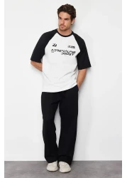  Collection تي شيرت أسود كبير الحجم/واسع القطع 100% قطن مطبوع من نسيج توك TMNSS24TS00139