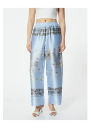 Koton بنطلون ساتان منقوش بالزهور - ساق واسعة وخصر مطاطي