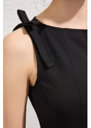  Collection بلوزة سوداء بأكمام بيبلوم وخصر صفر - محبوكة بفيونكة - TWOSS25BZ00482