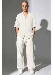 THE RULE بنطال رجالي من قماش الكتان فضفاض وفضفاض وقصة مستقيمة وساق مستقيمة مريح للصيف باللون البيج للموسم الجديد