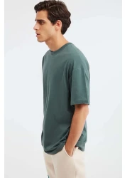 GRIMELANGE تي شيرت Jett رجالي كبير الحجم مصنوع من القطن العضوي بنسبة 100% ذو ياقة دائرية سميكة باللون الأخضر الداكن