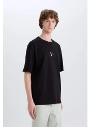 Defacto تي شيرت 100% قطن الفايكنج فالهالا بوكسي بياقة دائرية وطباعة خلفية وأكمام قصيرة E3277AX25SM