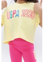 U.S. Polo Assn. طقم لباس ضيق برقبة دائرية للفتيات باللون الأصفر الفاتح