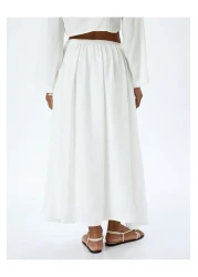 Koton تنورة طويلة واسعة بخصر عالٍ مع جيوب مبطنة