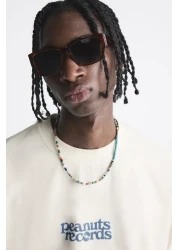 The Champ Clothing تي شيرت رجالي أبيض كبير الحجم مطبوع عليه سجلات Peanuts برقبة دائرية