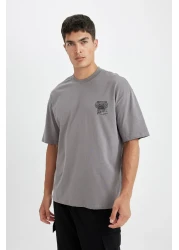 Defacto تي شيرت رمادي كبير الحجم للرجال - رقبة دائرية، طباعة خلفية، قطن، كم قصير D4908ax24au
