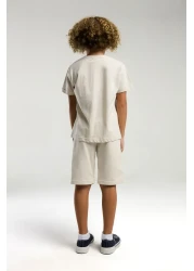 U.S. Polo Assn. بدلة برمودا كريمية للأولاد