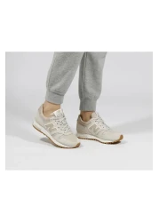 New Balance حذاء رياضي بيج للجنسين - حذاء رياضي كاجوال