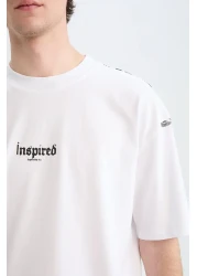 Defacto تي شيرت قطن 100% كبير الحجم بقصة واسعة وياقة دائرية وطباعة خلفية وأكمام قصيرة D5600ax25sp