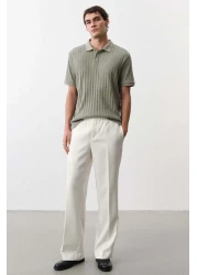 H&M قميص بولو جيرسي منسوج بقصّة Slim Fit