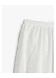 Koton تنورة طويلة واسعة بخصر عالٍ مع جيوب مبطنة